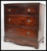 A Georgian style Regency revival bow fronted bachelors mahogany chest of drawers. The bank of