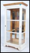 A 20th century up - cycled pine and glass display cabinet, double doors to the front fitted with