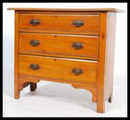 An early 20th century Edwardian walnut straight three cottage chest of drawers, drop handles
