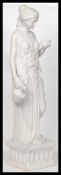 A 20th century floor standing marble statue of neo classical form depicting a maiden holding a pot