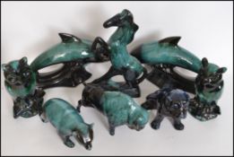 A collection of 20th century Blue Mountain pottery figurines to include Buffalo, owl, dolphins,