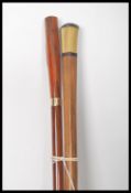 A pair of early 20th century Edwardian walking stick canes one having a tapering bamboo shaft with