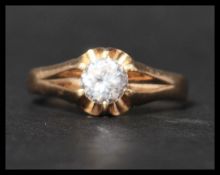 A hallmarked 9ct gold and white stone ring. Hallmarked for London. Weight 3.3g. Size T.