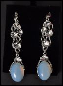 A pair of silver and moonstone drop earrings complete in presentation box.