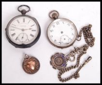Two vintage early 20th century pocket watches along with a silver hallmarked albert chain and two