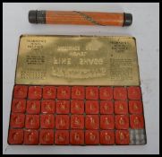 A vintage tin plate advertising pencil case calculator along with a Franklyn's fine shagg novel