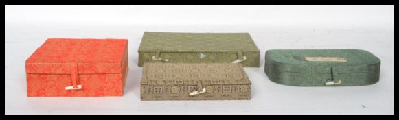 A group of three Oriental Chinese boxed calligraphy sets along with a boxed wax seal stamp set.