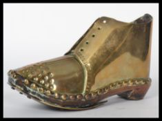 A 19th century ornamental hobnail boot / clog constructed from brass, wooden sole with hobnail