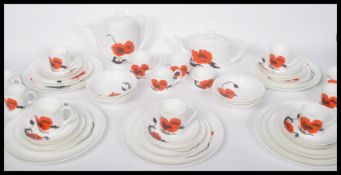 A 20th century retro Susie Cooper for Wedgwood Corn Poppy part dinner and tea service comprising