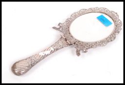 A 19th century Victorian silver hallmarked folding table / hand mirror having a scrolled and pierced