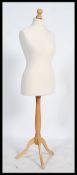 Vintage 20th century dress makers dummy raised on a tripod base stand.The bust is approx 97cm, the