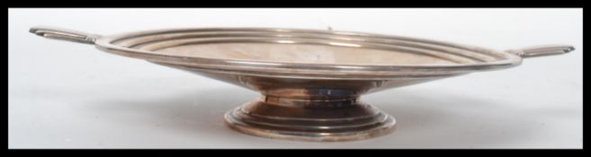 AN early 20th century silver plated Art Deco bowl having twin shaped handles in the manner of WMF.