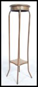A vintage retro torchere plant stand comprising of shaped copper piping and plywood plinths together