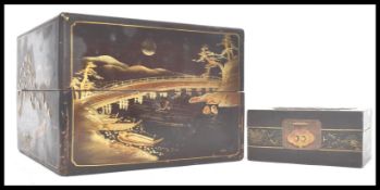 A pair of Japanese lacquered boxes. One being a small jewellery box and the other being a larger box