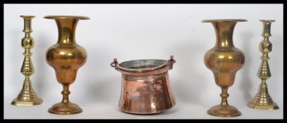 A pair of large Victorian brass candlesticks together with a large heavyIndian brass vase and a 19th