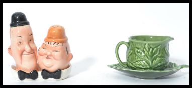 A vintage 20th century novelty Beswick Laurel and Hardy salt and pepper cruet set together with a