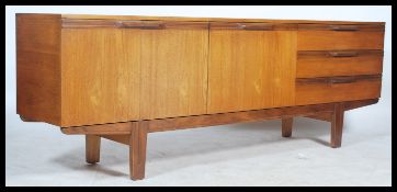 A retro 20th century teak wood long sideboard fitted with a run of three drawers and a series of