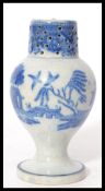A 19th century blue and white ceramic sander pounce pot having a circular vase with bulbous body and