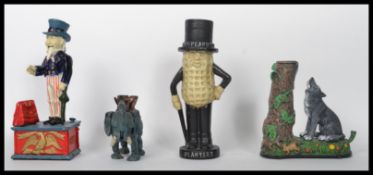 A collection of cast iron money boxes ( moneybox ) to include Mr Peanuts, Dumbo the elephant, Wolf