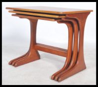 A retro 20th century nest of three E Gomme for G-Plan teak tables, the rectangular tops on