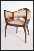 An Edwardian mahogany marquetry inlaid salon chair. Raised on shaped frame with railed back splat