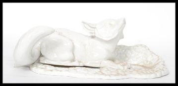 A 19th century Worcester prototype non produced model of a fox resting on a leaf with notation to