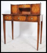 A Regency revival mahogany ladies writing table desk - bonheur de jour being raised on turned legs