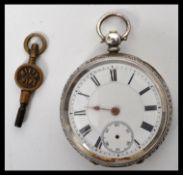 A Continental silver pocket watch having an enamel face with Roman numeral chapter rings and faceted
