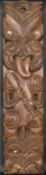 An early 20th century well carved large Maori tribal warrior wooden wall hanging with typical paua