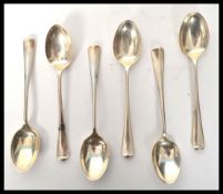 A set of six silver hallmarked 1930's tea spoons in the Hanoverian pattern having elongated rat