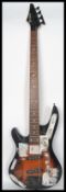 A vintage 20th century Samick bass guitar having inset mother of pearl fret markers.