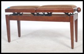 A contemporary mahogany adjustable duet piano stool. The double stool with adjustable seat