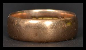 A gentleman's large 9ct gold band ring of usual form weighing 7.7g