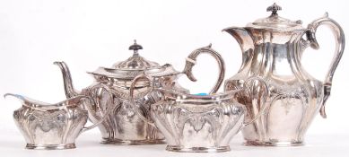 An Edwardian matching four piece silver plated tea service, consisting of teapot, water pot, sugar