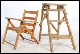 A vintage 20th century folding wooden step ladder / library steps of small proportions together with