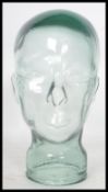 A 20th century moulded pressed glass phrenology type head - shop display stand / millinery mannequin