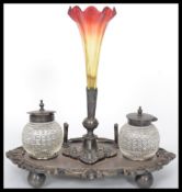 A silver plated desk tidy / ink well having a central glass epergne ruby glass pen holder flanked by
