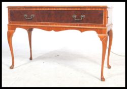 A vintage 20th century mahogany and walnut Dynatron stereogram being raised on cabriole legs with