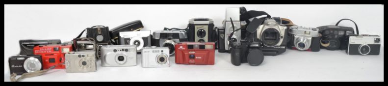 A collection of vintage cameras to include Beirette, Cannon EOS 300, Ensign Ful View, Kodaks,