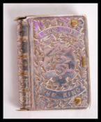 A silver plated commemorative vesta case in the form of a book with notation reading 'Long Live