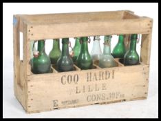 A vintage 20th century Industrial wooden crate of bottles being complete. The box with original