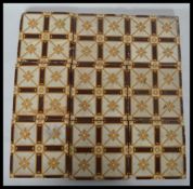 A set of nine 19th century Victorian encaustic ceramic tiles by Campbell. Measures 15.5 cm wide