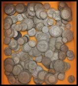 A large collection of vintage silver and copper British coins dating from the 19th century to