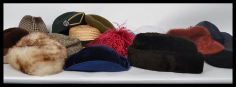 A good collection of vintage ladies and gentlemans hats ( hat )  dating from the 20th century to