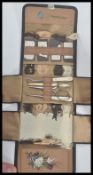 A 19th century Victorian leather sewing necessaire wallet containing thread needles scissors etc.