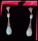 A pair of silver marcasite and opal drop earrings in the art deco style. Complete in presentation