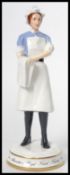 A Michael Sutty ceramic figurine of a nurse limited edition 53/250 model number 1986. Measures 20.