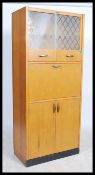 A retro 1950's oak veneer Pride-O-Home kitchen dresser cabinet comprising a series of cupboards