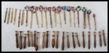 A collection of lace bobbins dating from the early 19th century of various form. Please see