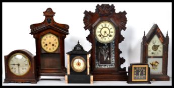 A collection of vintage and antique mantel clocks dating from the 19th century to include